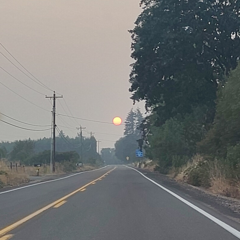Red sun over a highway